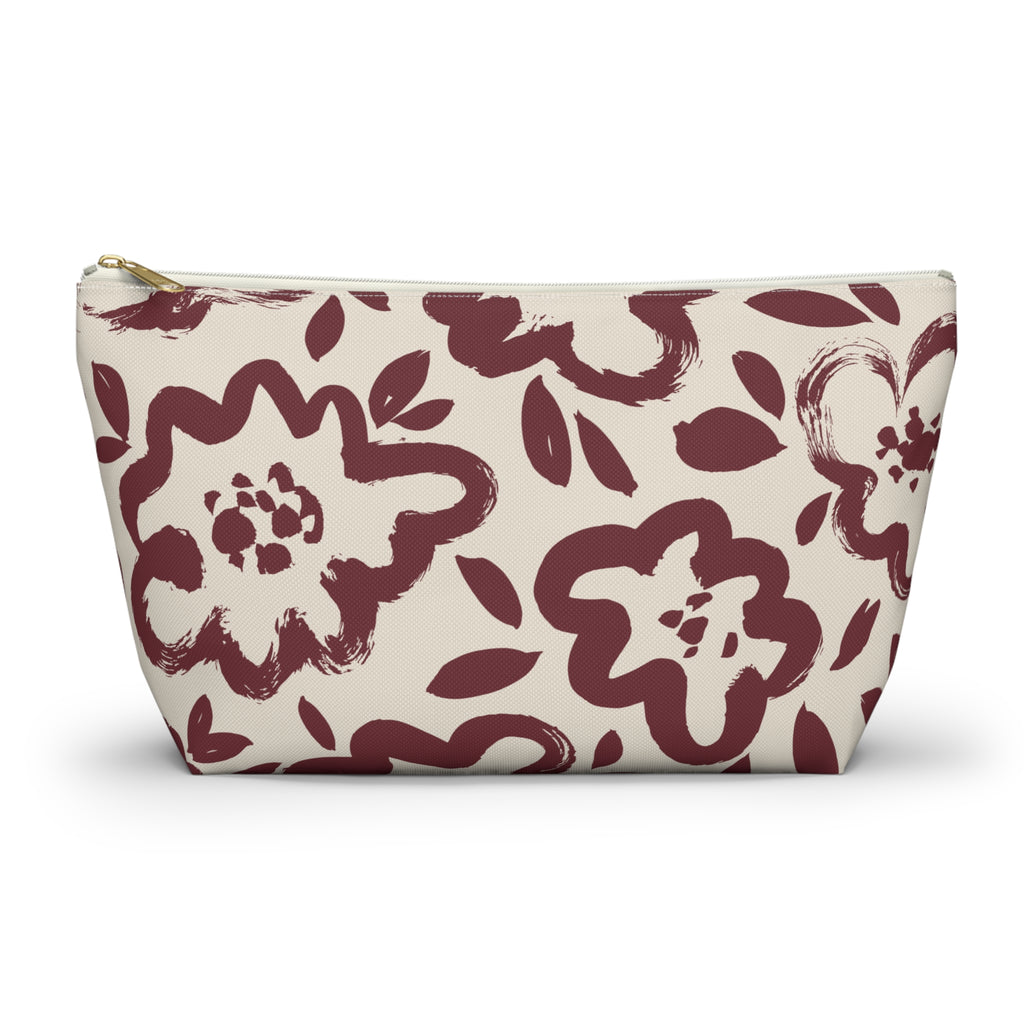 Burgundy cream floral makeup bag with T-bottom shape seen from the front