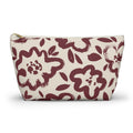 Burgundy cream floral makeup bag with T-bottom shape seen from the front