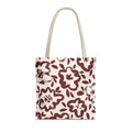 Burgundy cream floral tote bag with beige handles on a white background