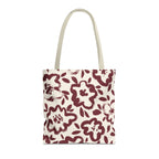 Burgundy cream floral tote bag with beige handles on a white background