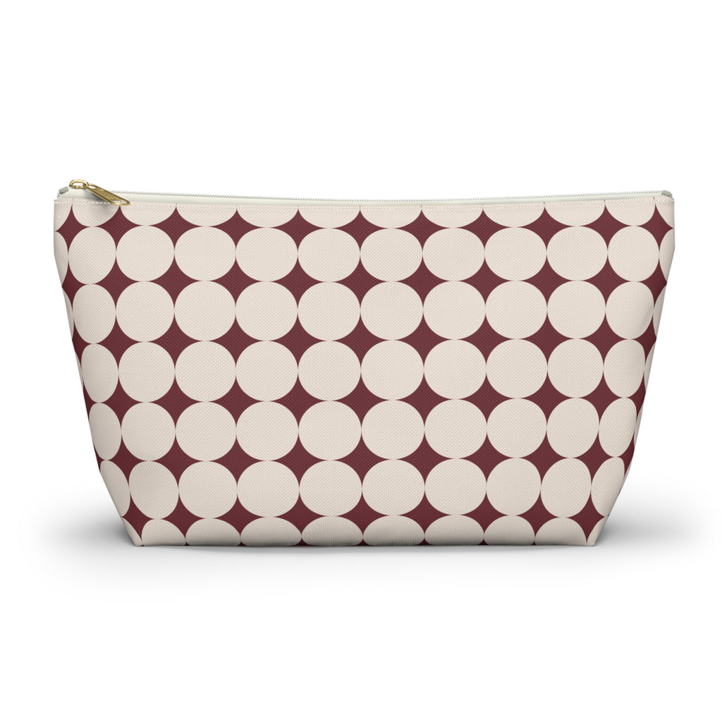 Burgundy Cream Geometric makeup bag with T-bottom and gold zipper pull, front view