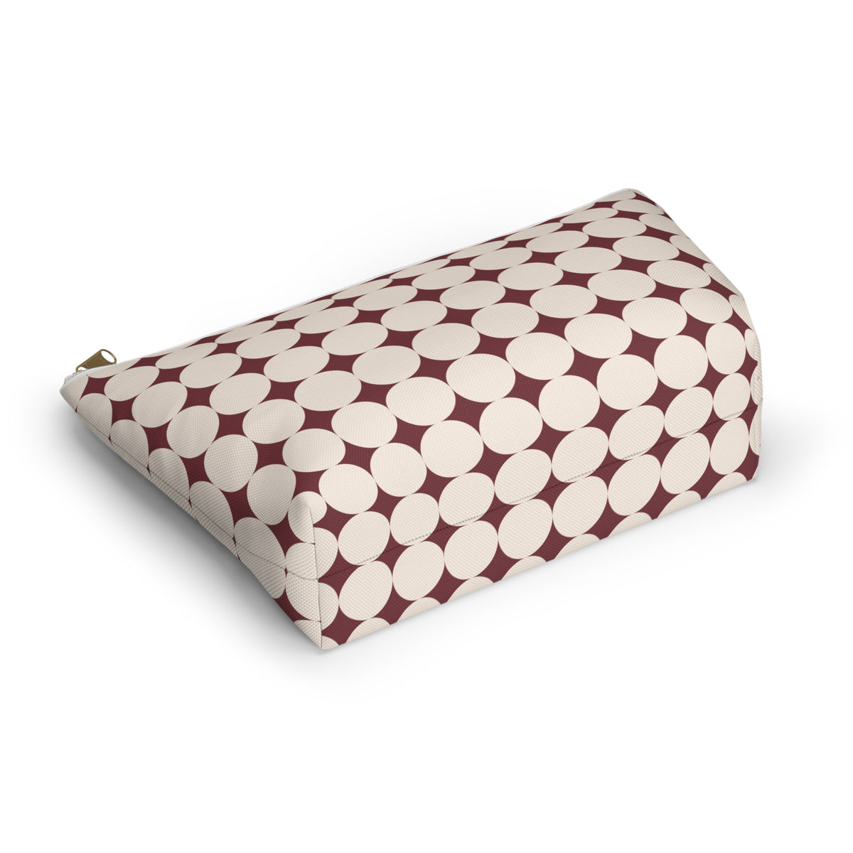 Angled view of the retro geometric makeup bag lying on its side