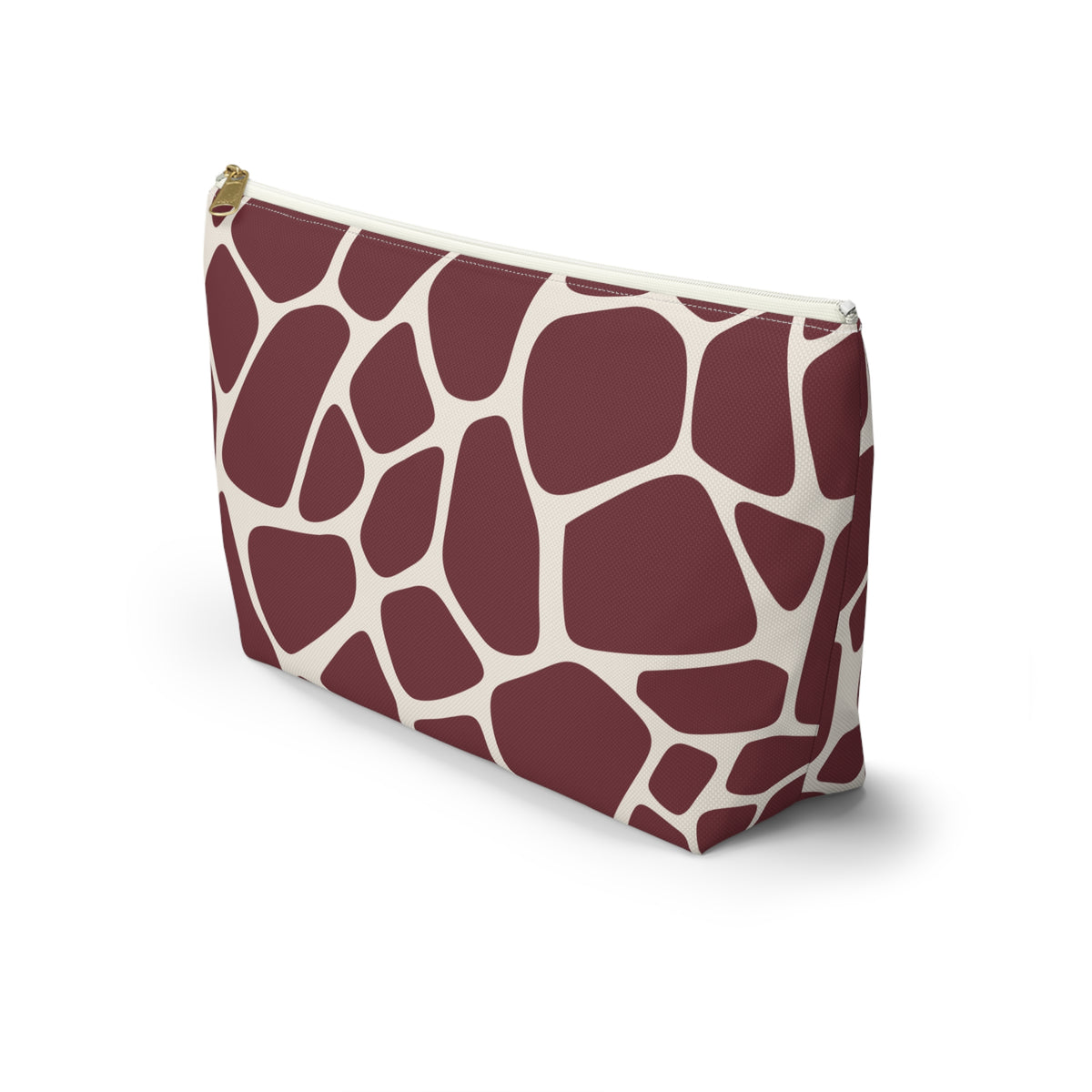 Side view of the burgundy giraffe print makeup bag with cream lines
