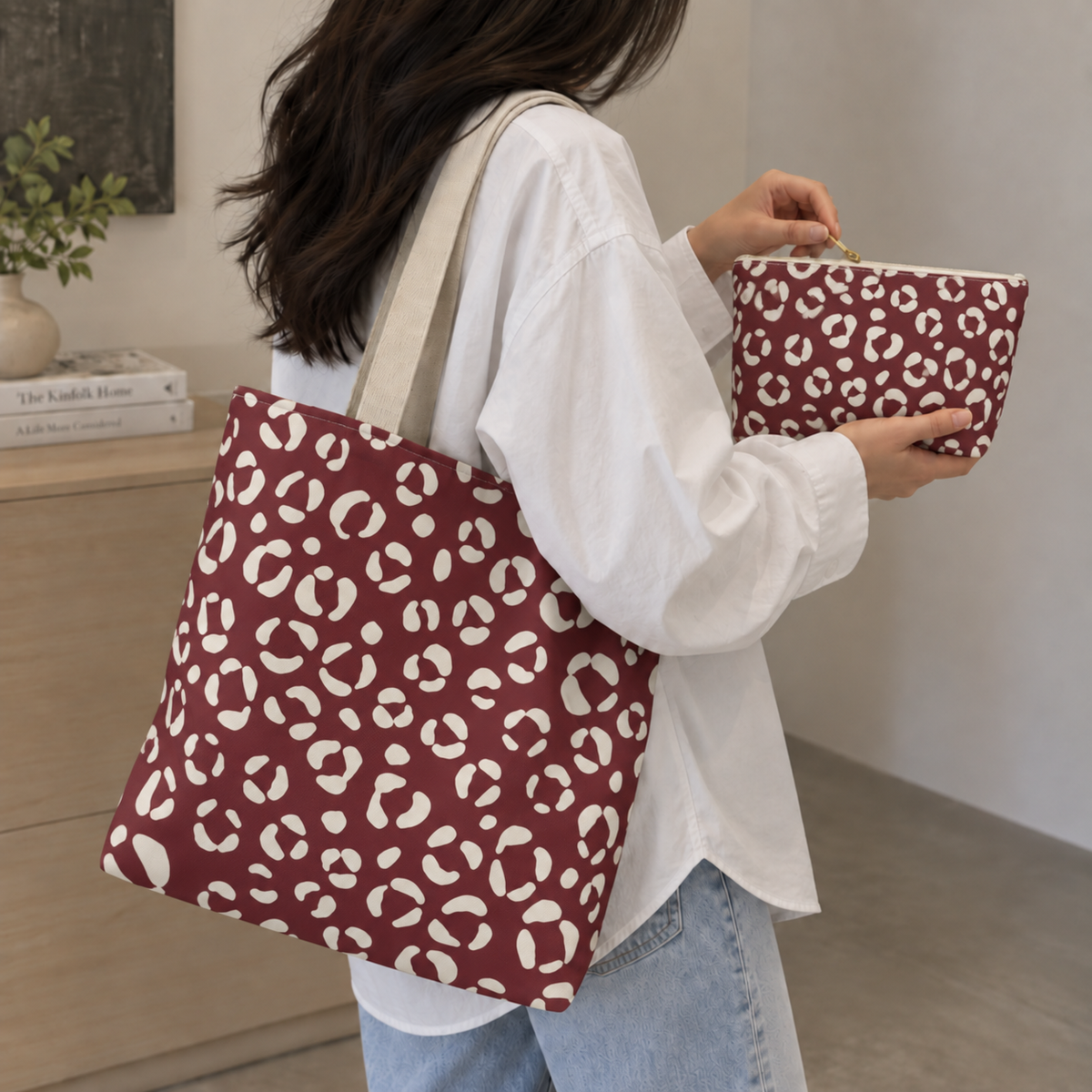 Burgundy cream leopard print tote bag on the shoulder with the matching makeup bag