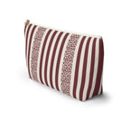 Side view of the burgundy and cream striped makeup bag