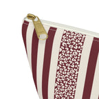 Close-up of the gold zipper pull, burgundy stripes and leopard spot panel