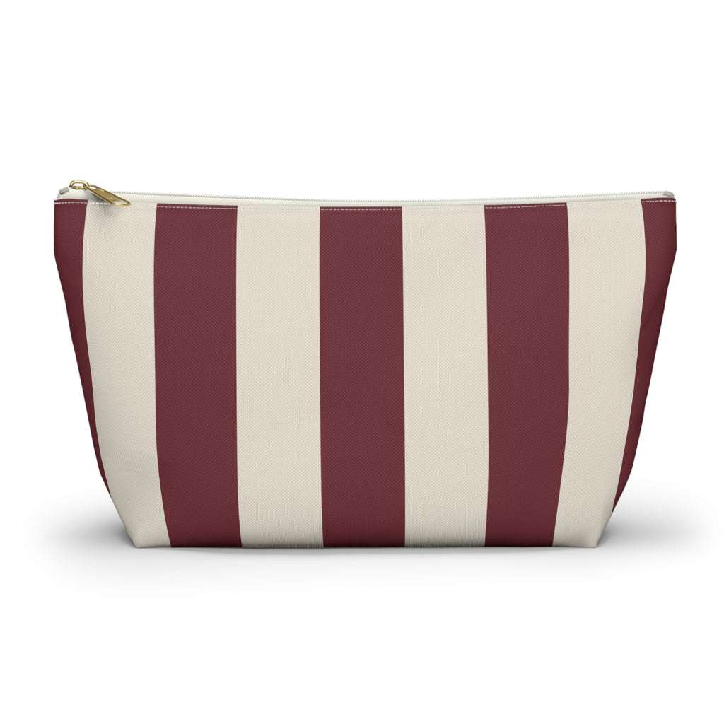 Burgundy cream striped makeup bag with T-bottom and gold zipper pull, front view