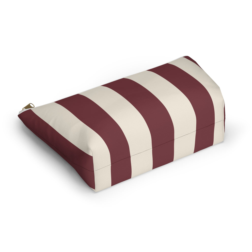 Burgundy cream striped makeup bag lying on its side showing the wide stripes
