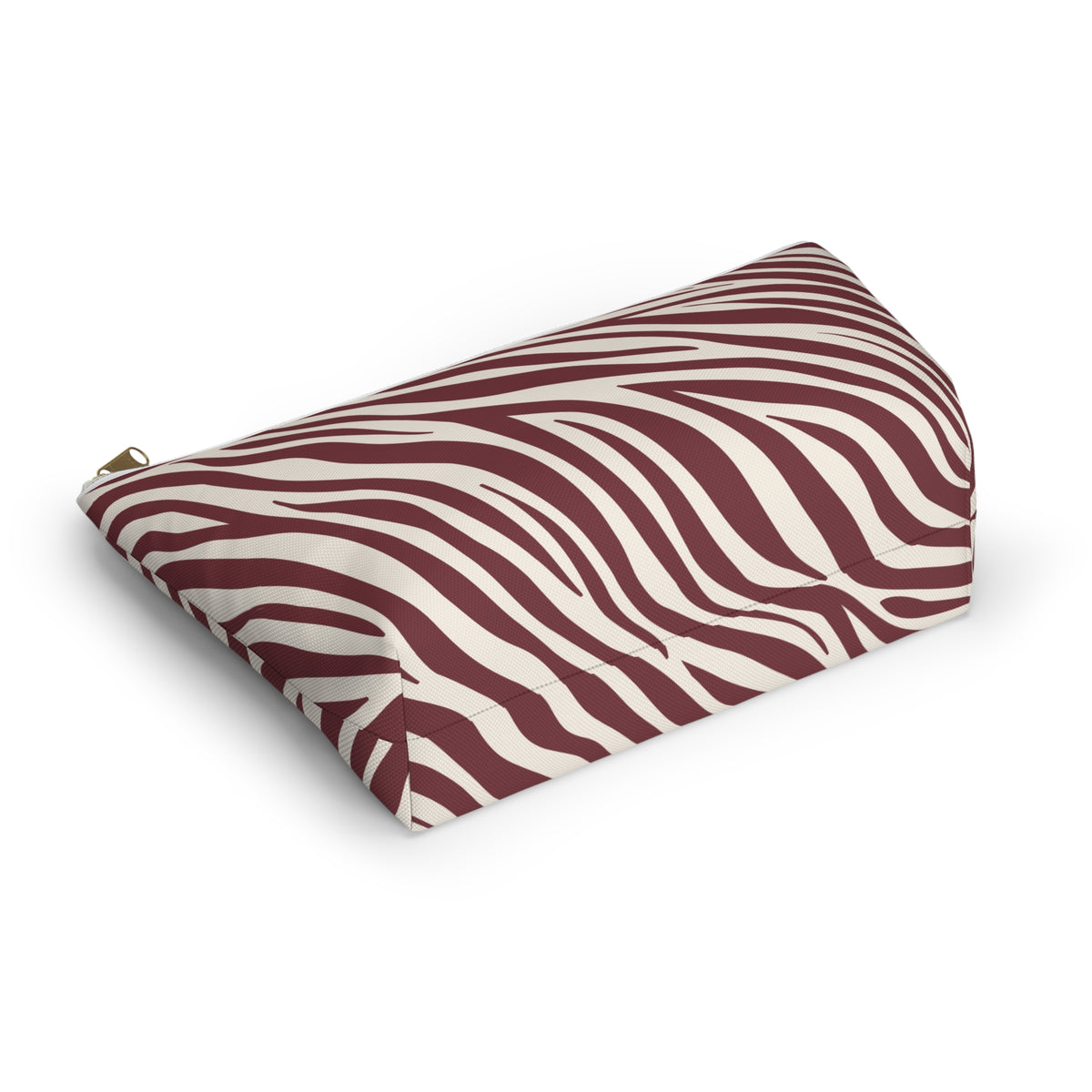 Burgundy zebra print cosmetic bag lying at an angle