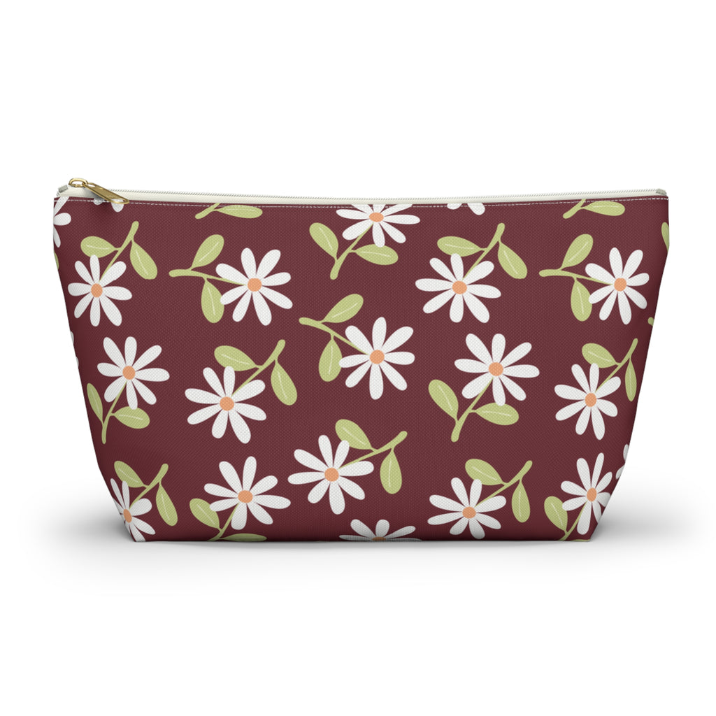 Burgundy daisy floral makeup bag with gold zipper pull, front view on white background