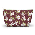 Burgundy daisy floral makeup bag with gold zipper pull, front view on white background