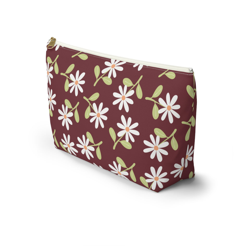 Side view of the daisy floral makeup bag in burgundy with T-bottom shape