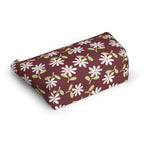 Daisy floral makeup bag lying on its side showing white daisies on burgundy
