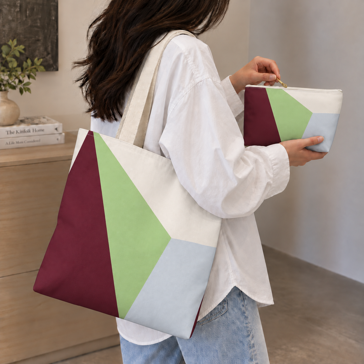 Woman carrying the burgundy green color block tote bag with the matching makeup bag