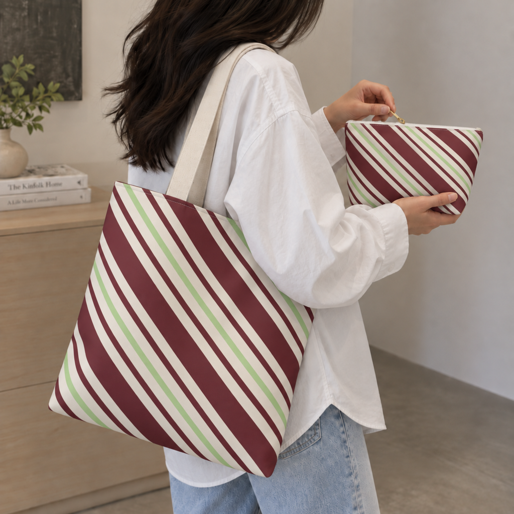 Woman with the diagonal striped tote bag and matching makeup bag