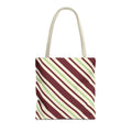 Burgundy green diagonal striped tote bag with cream handles on a white background