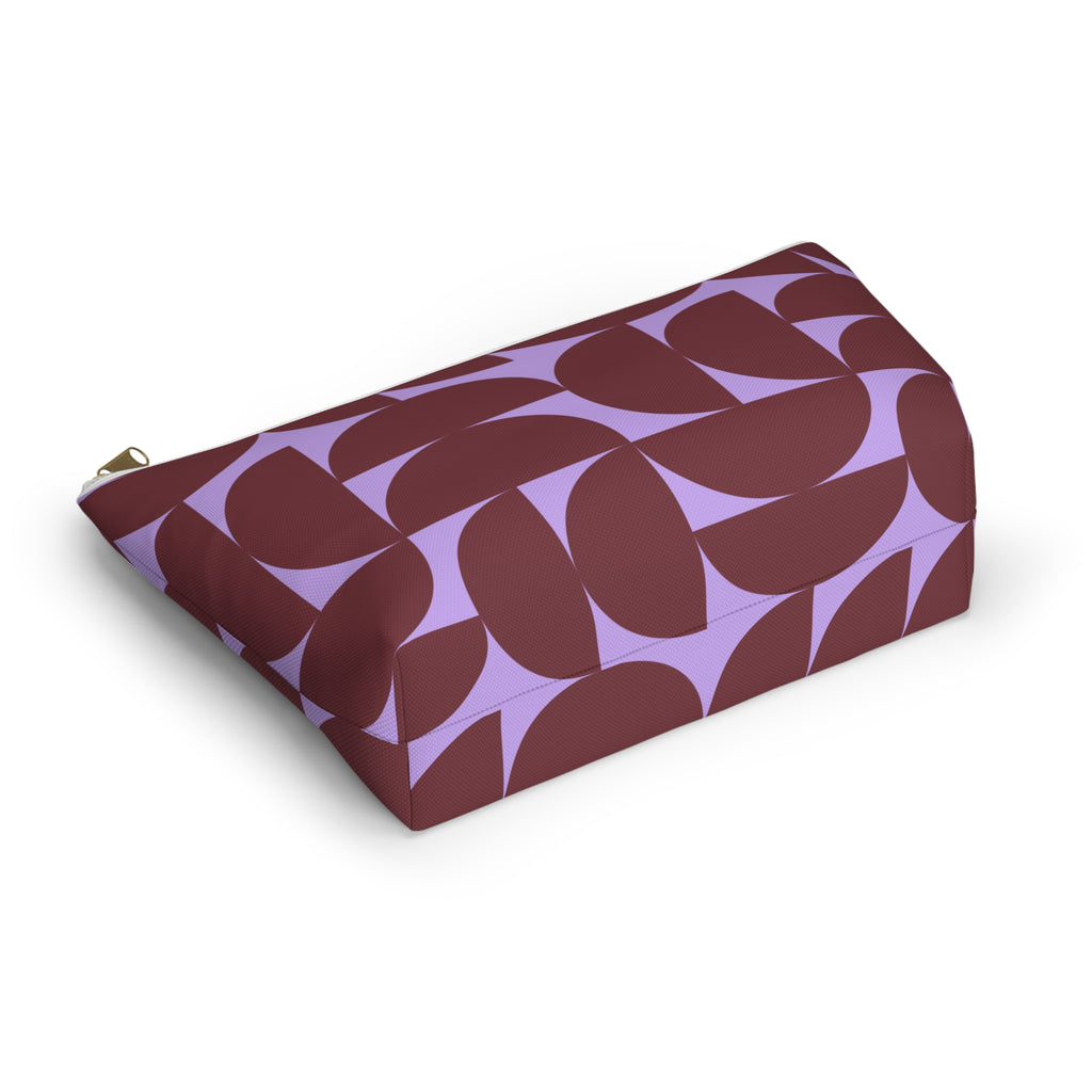 Burgundy lilac half circle makeup bag lying on its side in an angled view