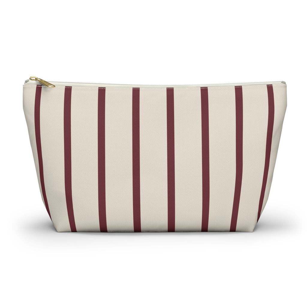 Burgundy pinstripe makeup bag with T-bottom and gold zipper pull, front view