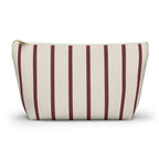 Burgundy pinstripe makeup bag with T-bottom and gold zipper pull, front view
