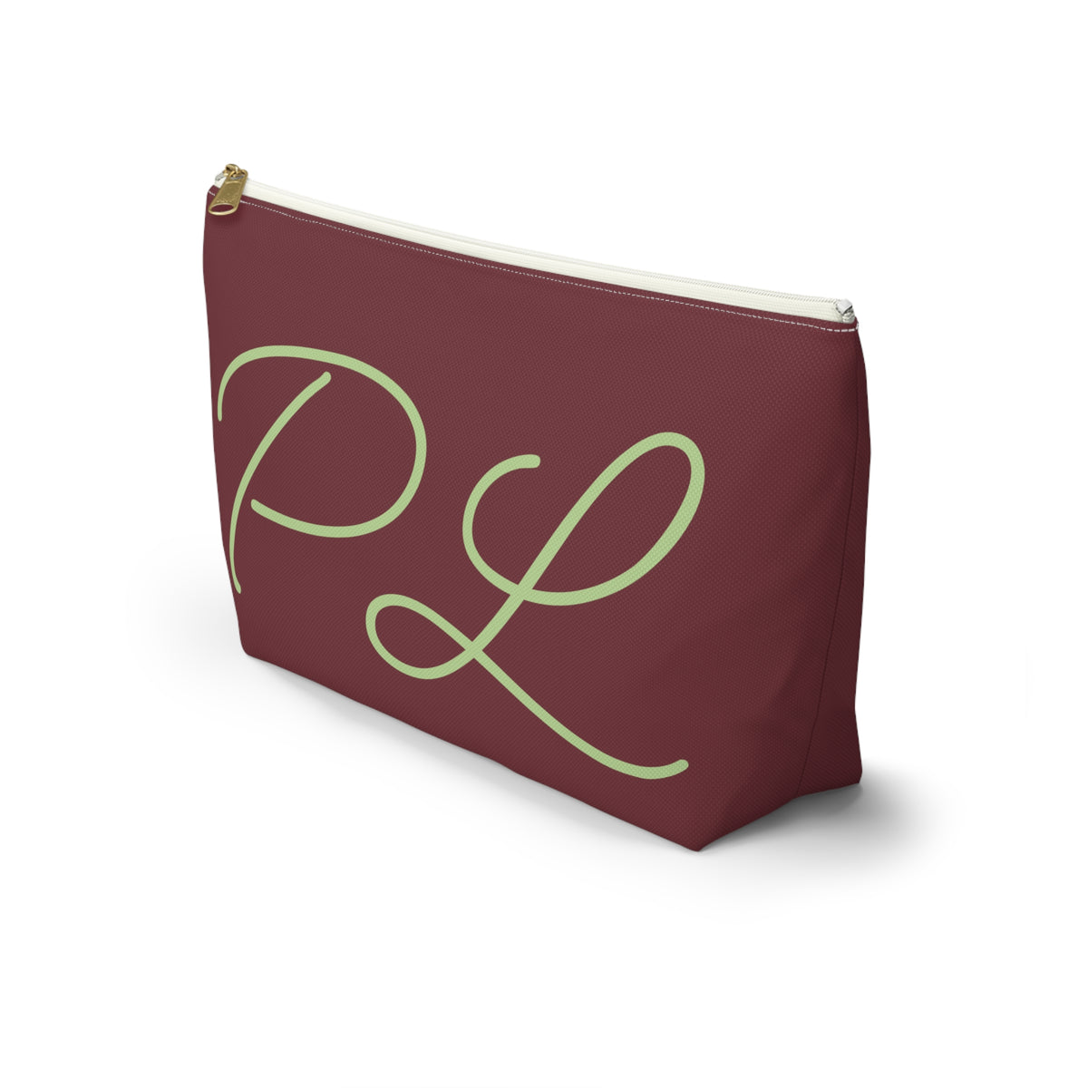 Side view of the burgundy monogram makeup bag with sage green script initials