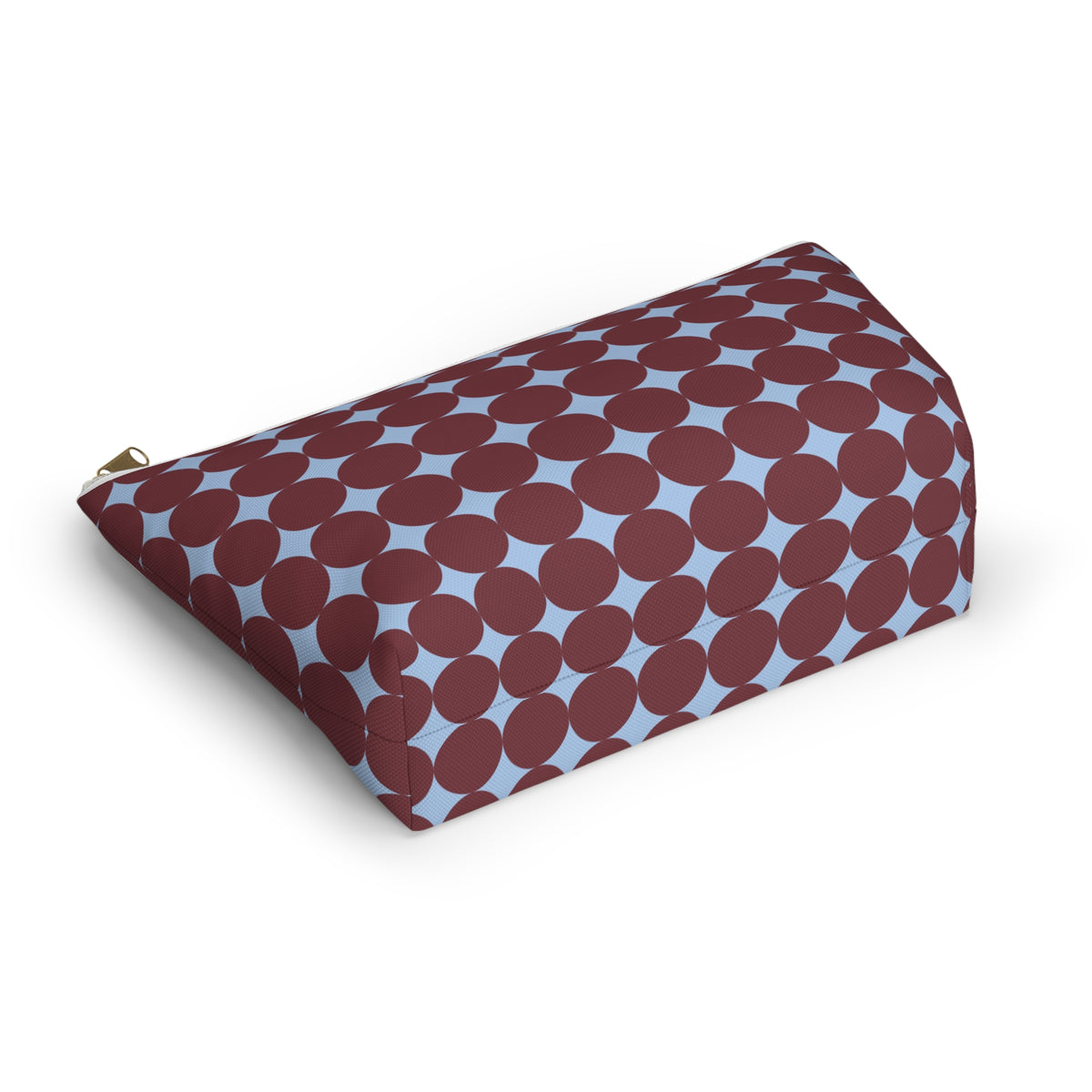 Angled view of the retro geometric makeup bag lying on its side