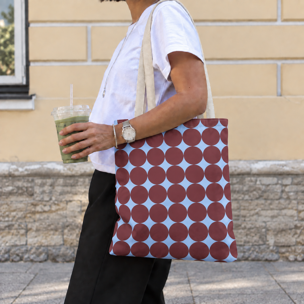 Woman walking with the Burgundy Sky Blue Geometric tote bag on her shoulder