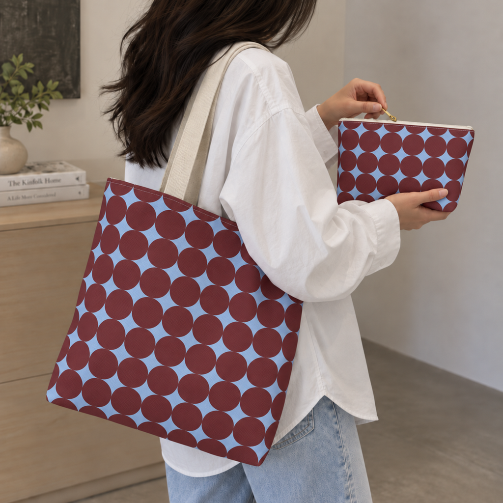 Model holding the Burgundy Sky Blue Geometric tote bag with the matching makeup bag