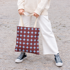 Model in white trousers carrying the retro Burgundy Sky Blue Geometric tote bag
