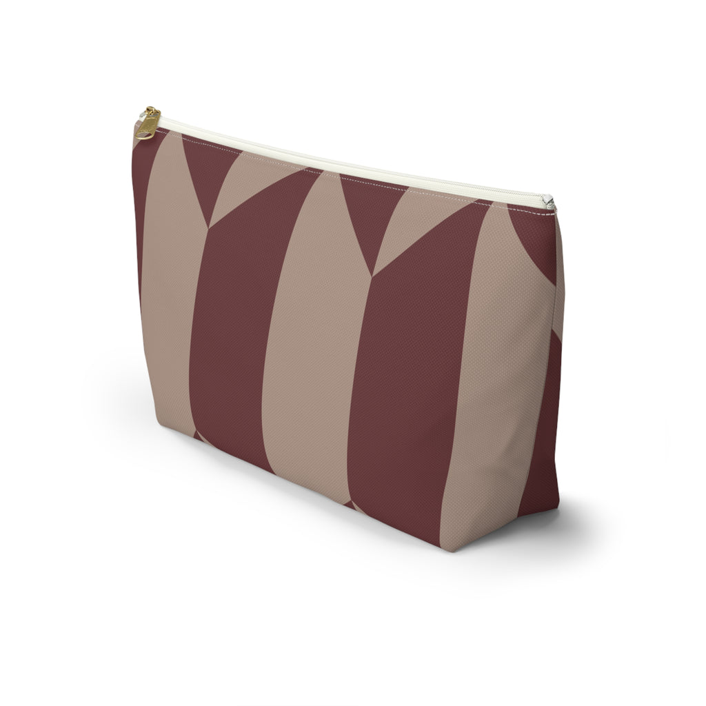 Side view of the burgundy taupe geometric makeup bag with flat T-shaped bottom