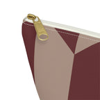 Close-up of the gold zipper pull on the burgundy taupe geometric makeup bag