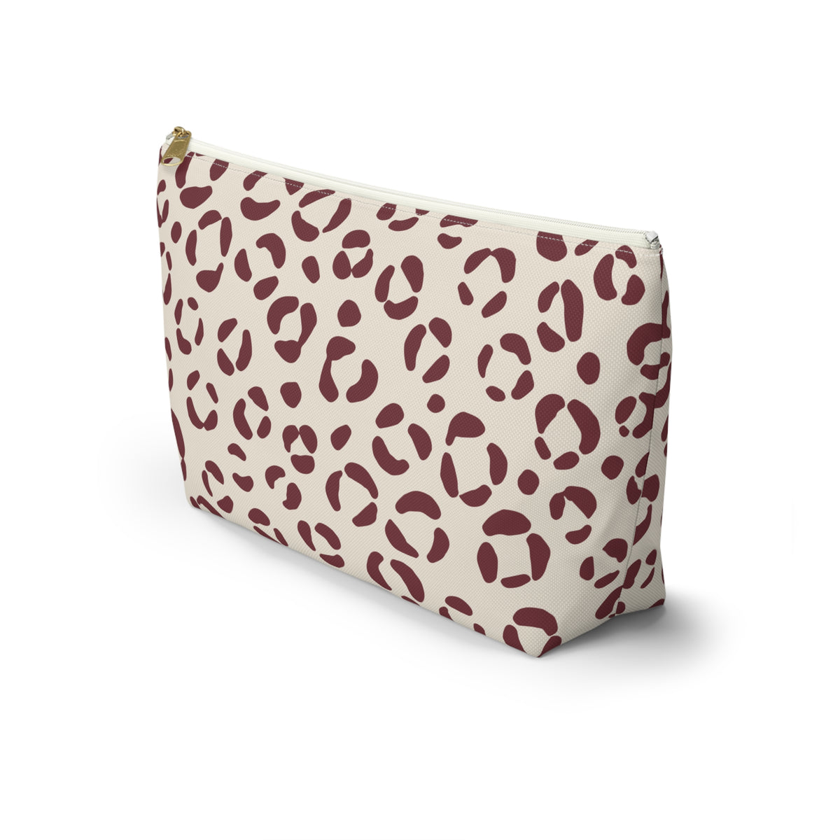 Side view of the cream and burgundy leopard print makeup bag