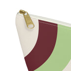 Close-up of the gold zipper pull on the Cream Green Burgundy Wavy makeup bag