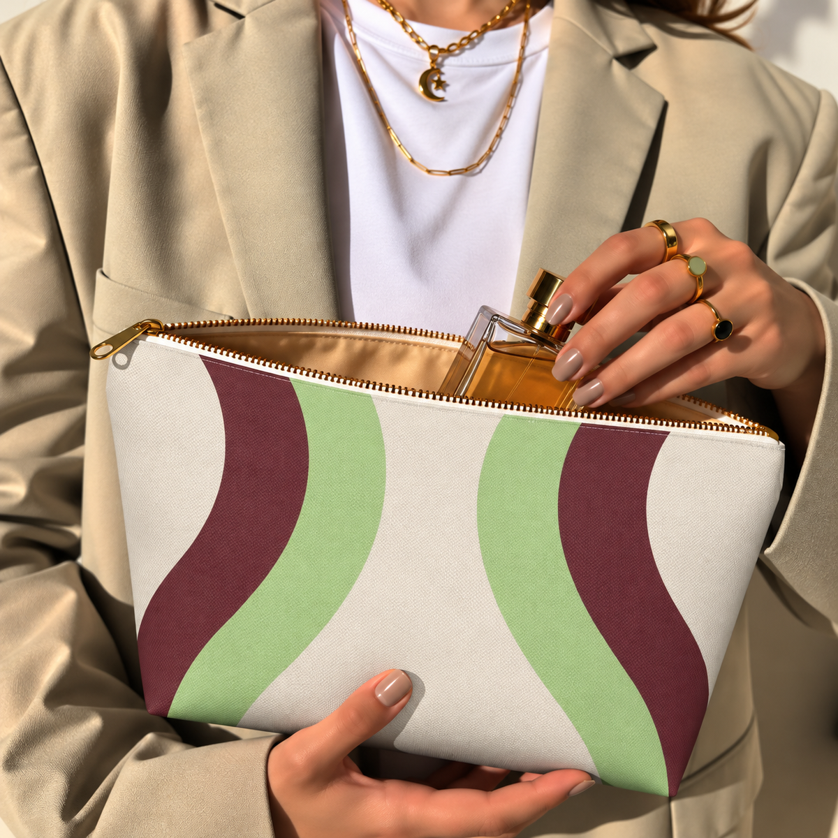 Hands holding the open Cream Green Burgundy Wavy makeup bag