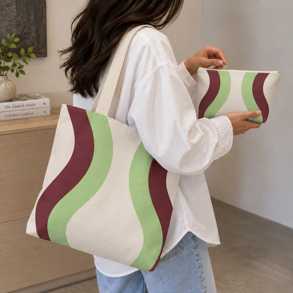 Woman carrying the Cream Green Burgundy Wavy tote bag on her shoulder with the matching makeup bag