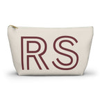 Cream personalized makeup bag with burgundy outlined RS initials and gold zipper pull