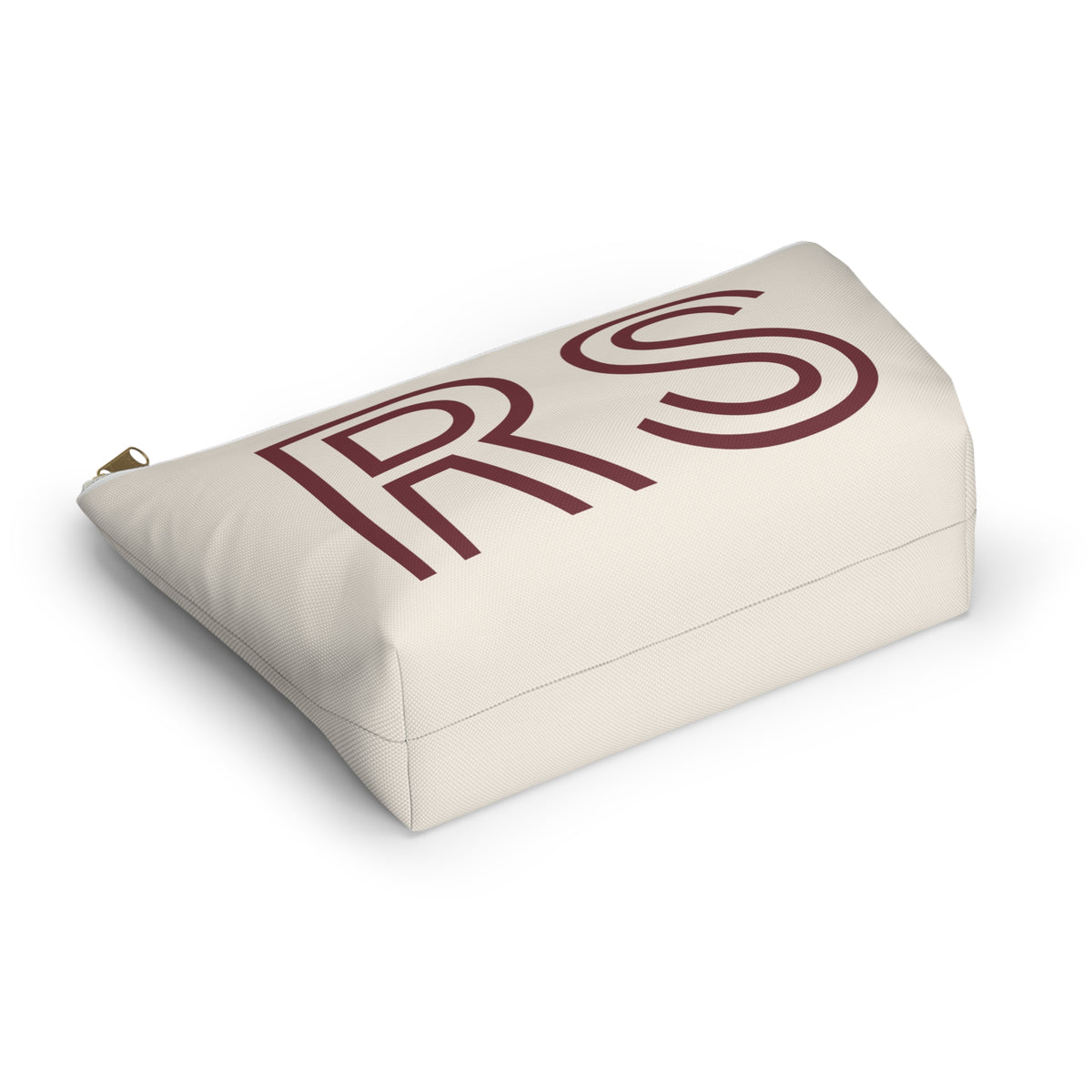 Cream RS monogram cosmetic bag lying at an angle