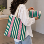 Woman carrying the matching tote bag and Emerald Green Pink Striped makeup bag