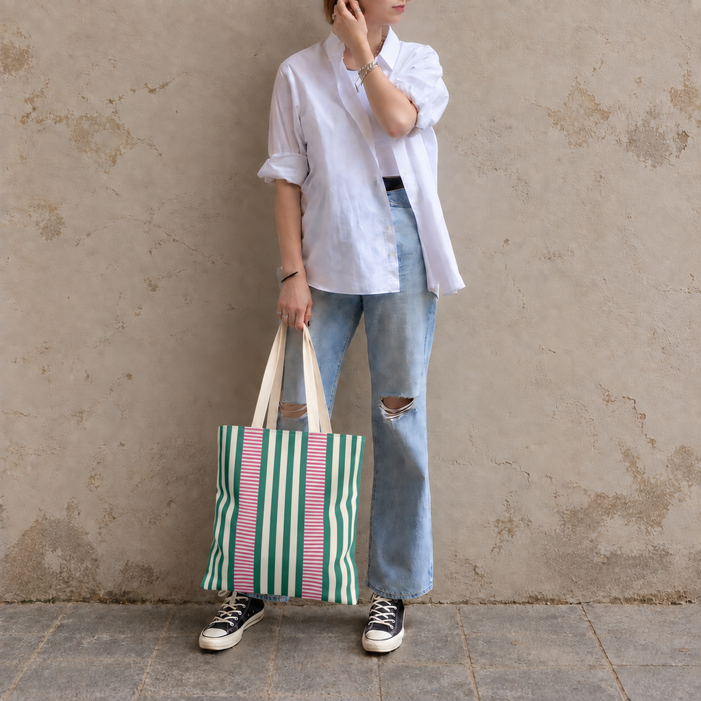Full-length model photo with the Emerald Green Pink Striped tote bag against a wall