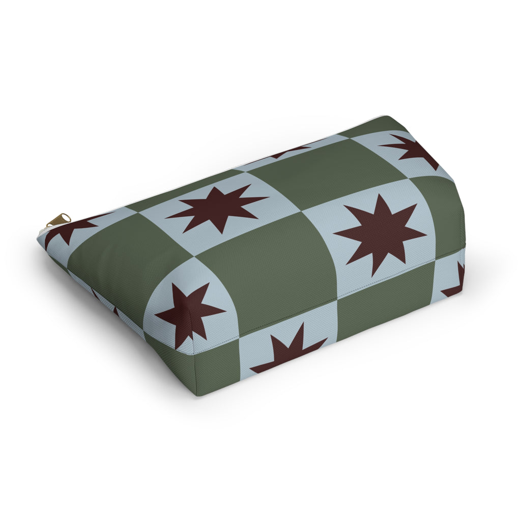 Green blue star checkered makeup bag lying on its side in an angled view