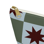 Close-up of the gold zipper pull on the green blue star checkered makeup bag