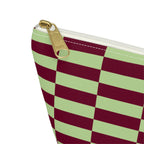 Close-up of the gold zipper pull on the green burgundy checkered makeup bag