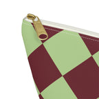 Close-up of the gold zipper pull and sage burgundy diamond checks on the makeup bag