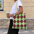 Woman walking with the green burgundy diamond checkered tote bag on her shoulder