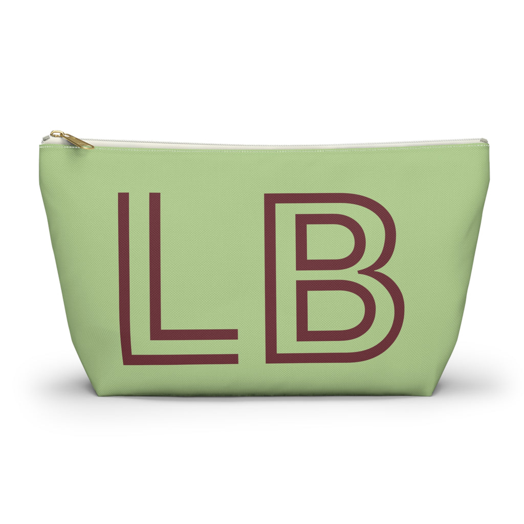 Sage green personalized makeup bag with burgundy outlined LB initials and gold zipper pull on a white background