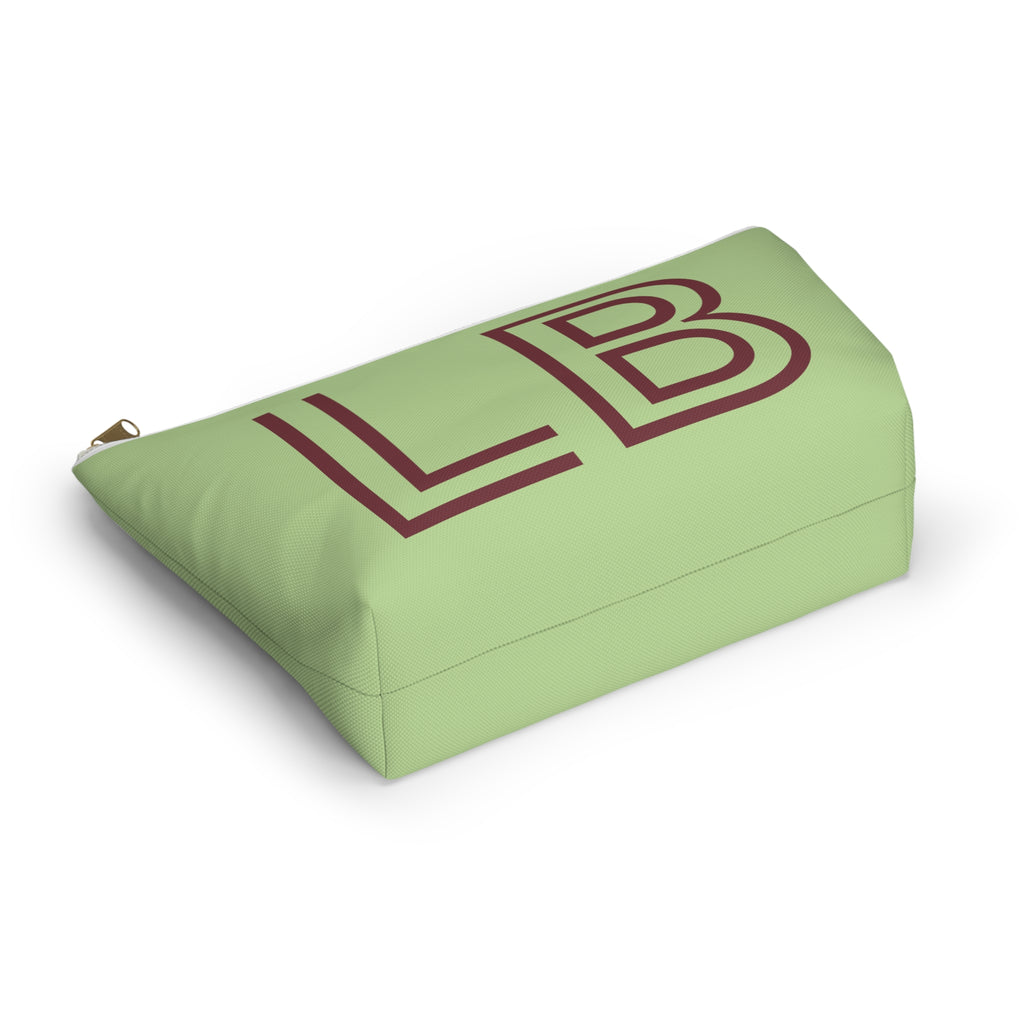 Green burgundy personalized makeup bag lying at an angle on a white background