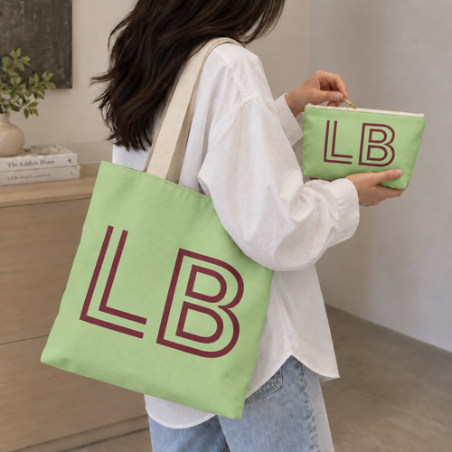 Woman carrying the green burgundy monogram personalized tote bag with the matching makeup bag