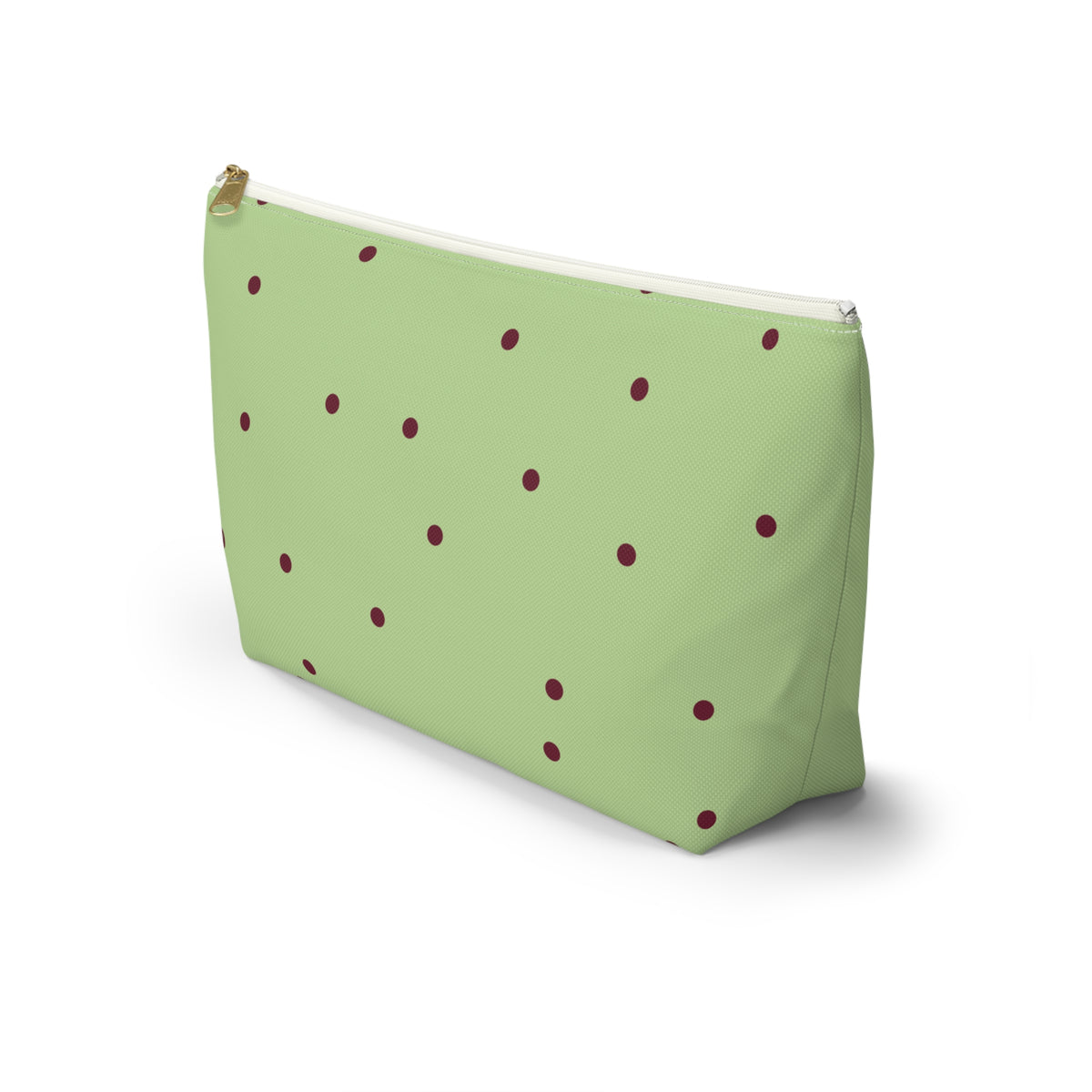 Green burgundy polka dot makeup bag standing at an angle