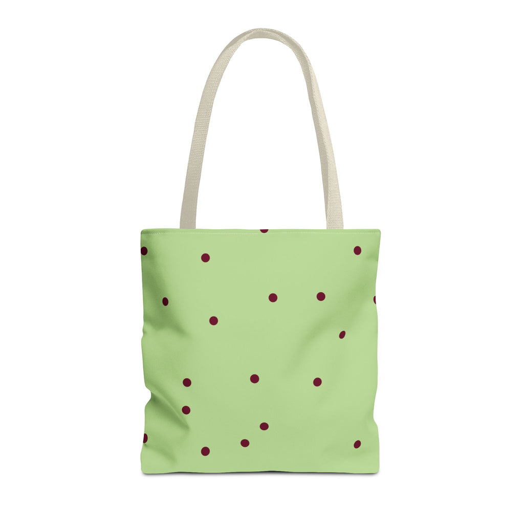 Green burgundy polka dot tote bag with beige handles on a white background