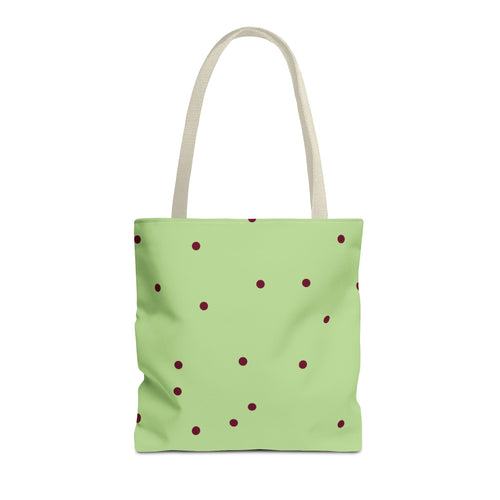 Green burgundy polka dot tote bag with beige handles on a white background