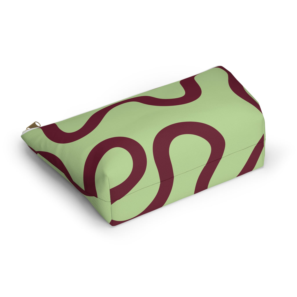 Green burgundy wavy line makeup bag lying on its side